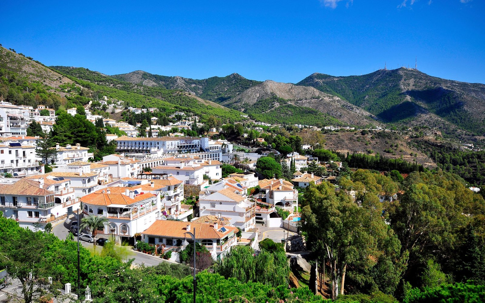 Mijas Pueblo, the white village on the hillside, with the Sierra de Mijas behind.